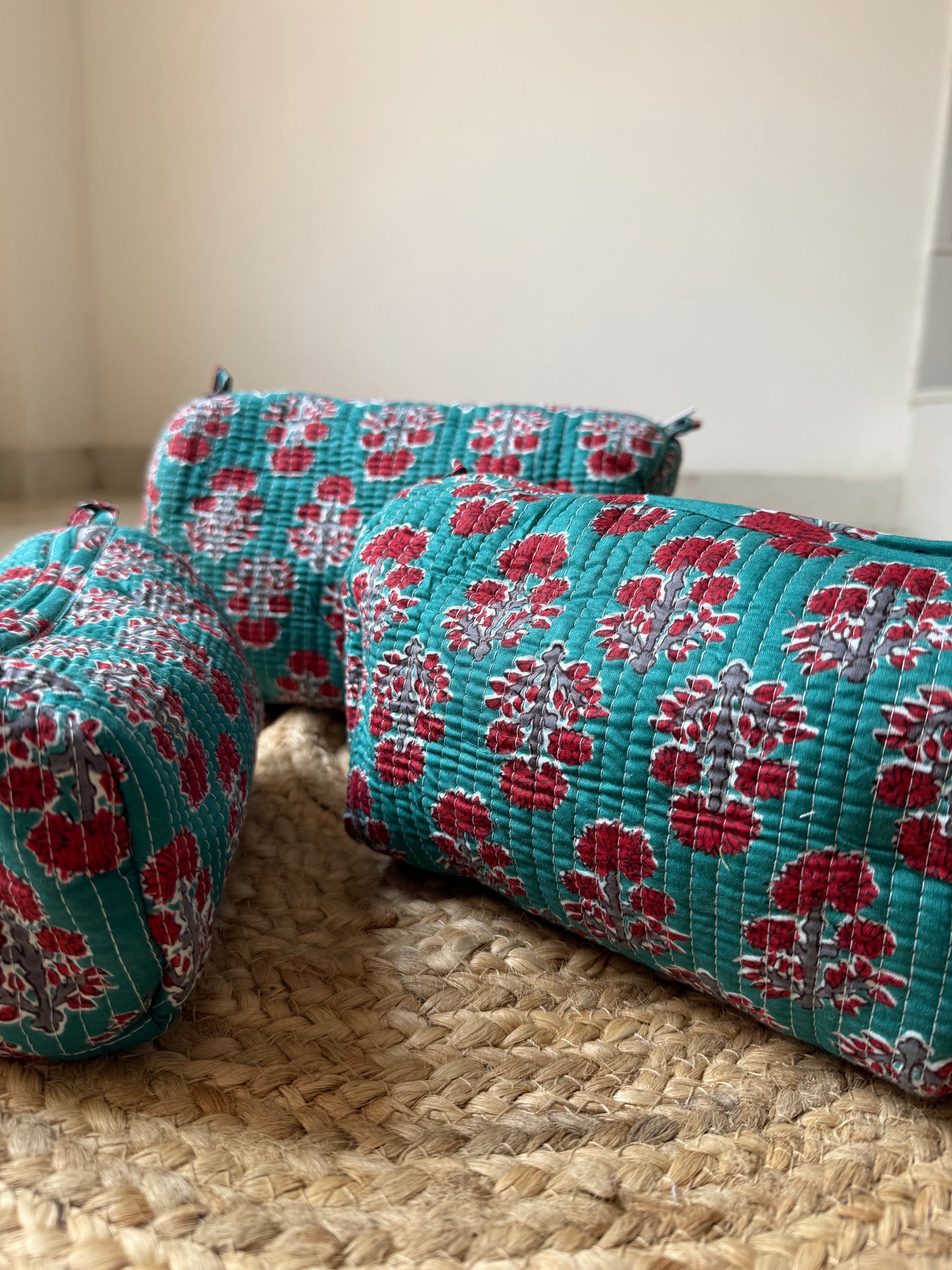 Red motifs on Rama green Makeup/cosmetics/toiletry pouches