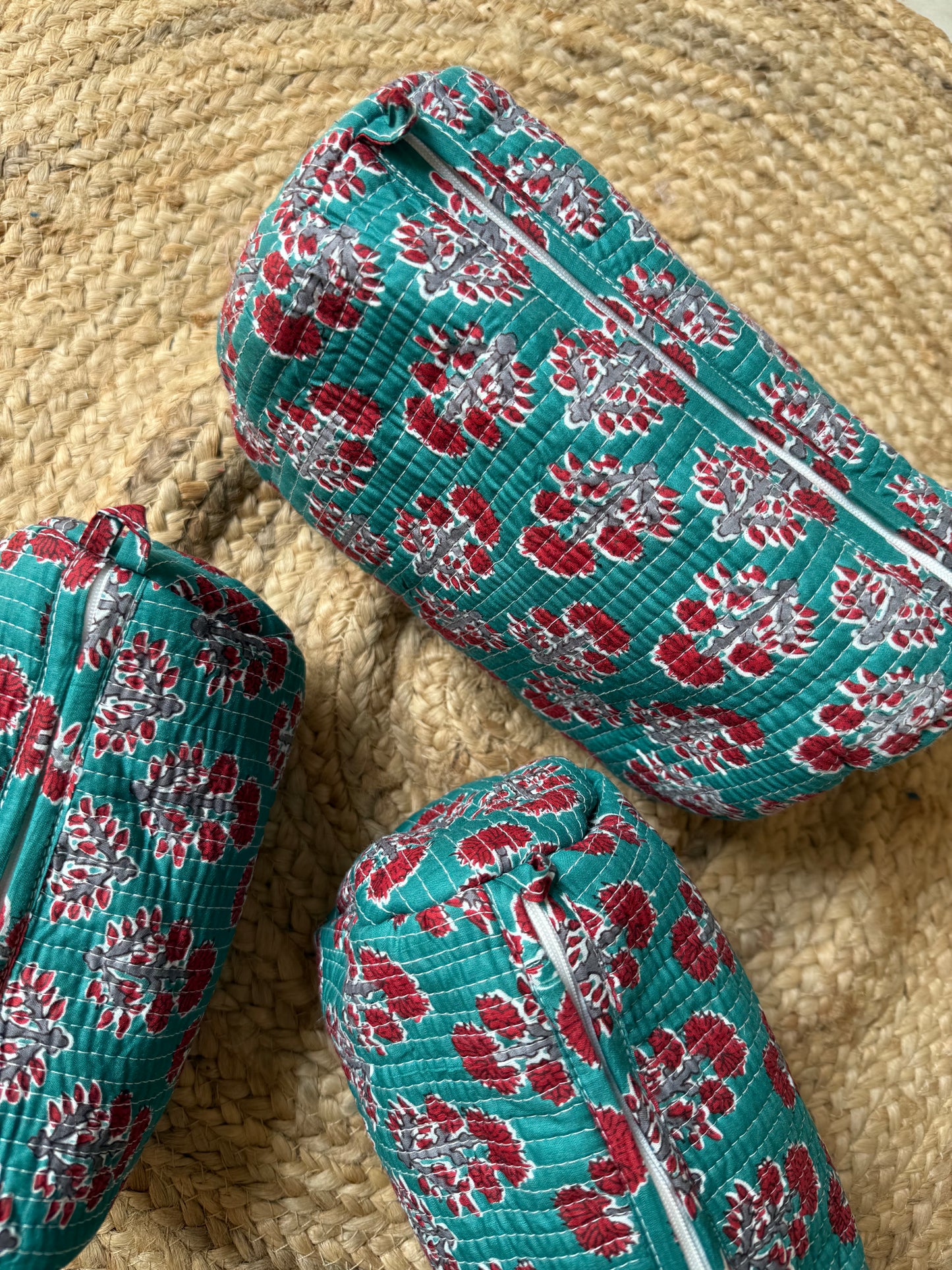 Red motifs on Rama green Makeup/cosmetics/toiletry pouches